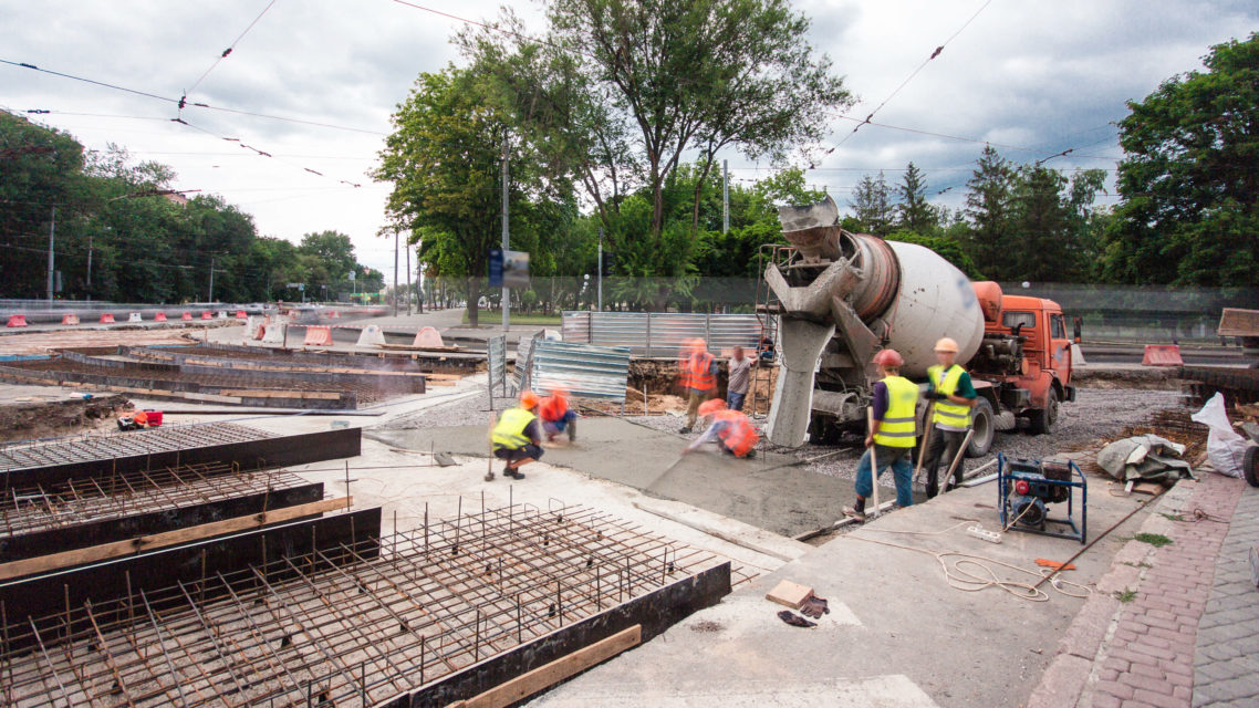 Concrete Works For Road Maintenance Construction With Many Workers And Mixer Timelapse
