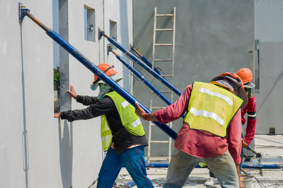 Construction Worker Are Installing The Precast Concrete Wall, Or